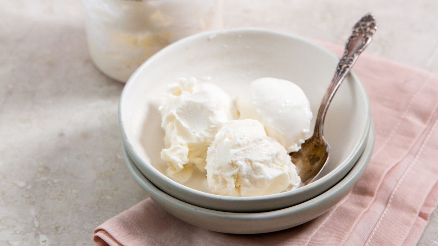 Ninja CREAMi Vanilla ICe Cream Recipe in a white bowl with a spoon.