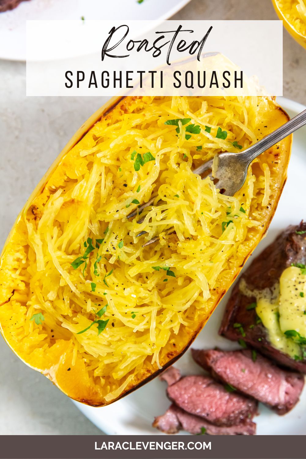 pin of Roasted Spaghetti Squash with a fork in it with ribeye steak on a white plate