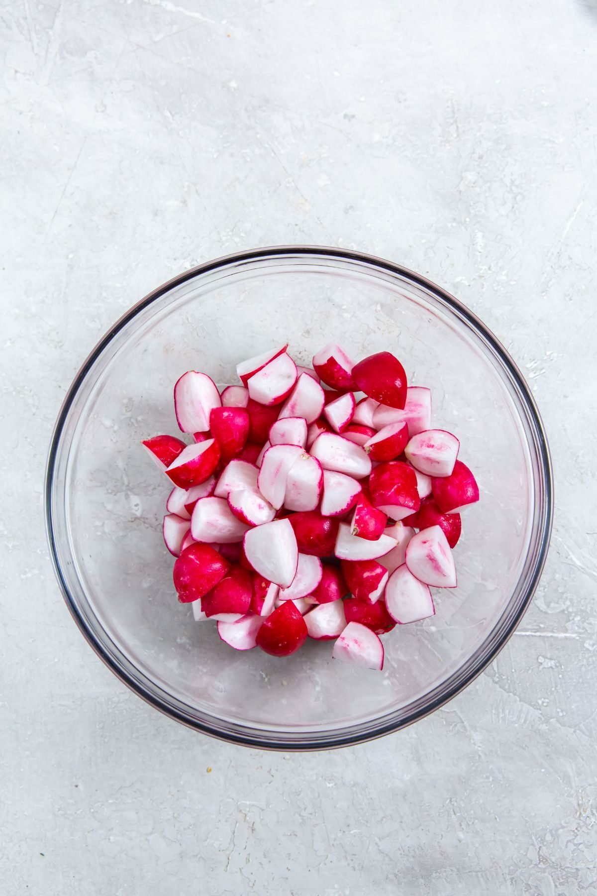 cut radishes in a clear bowl