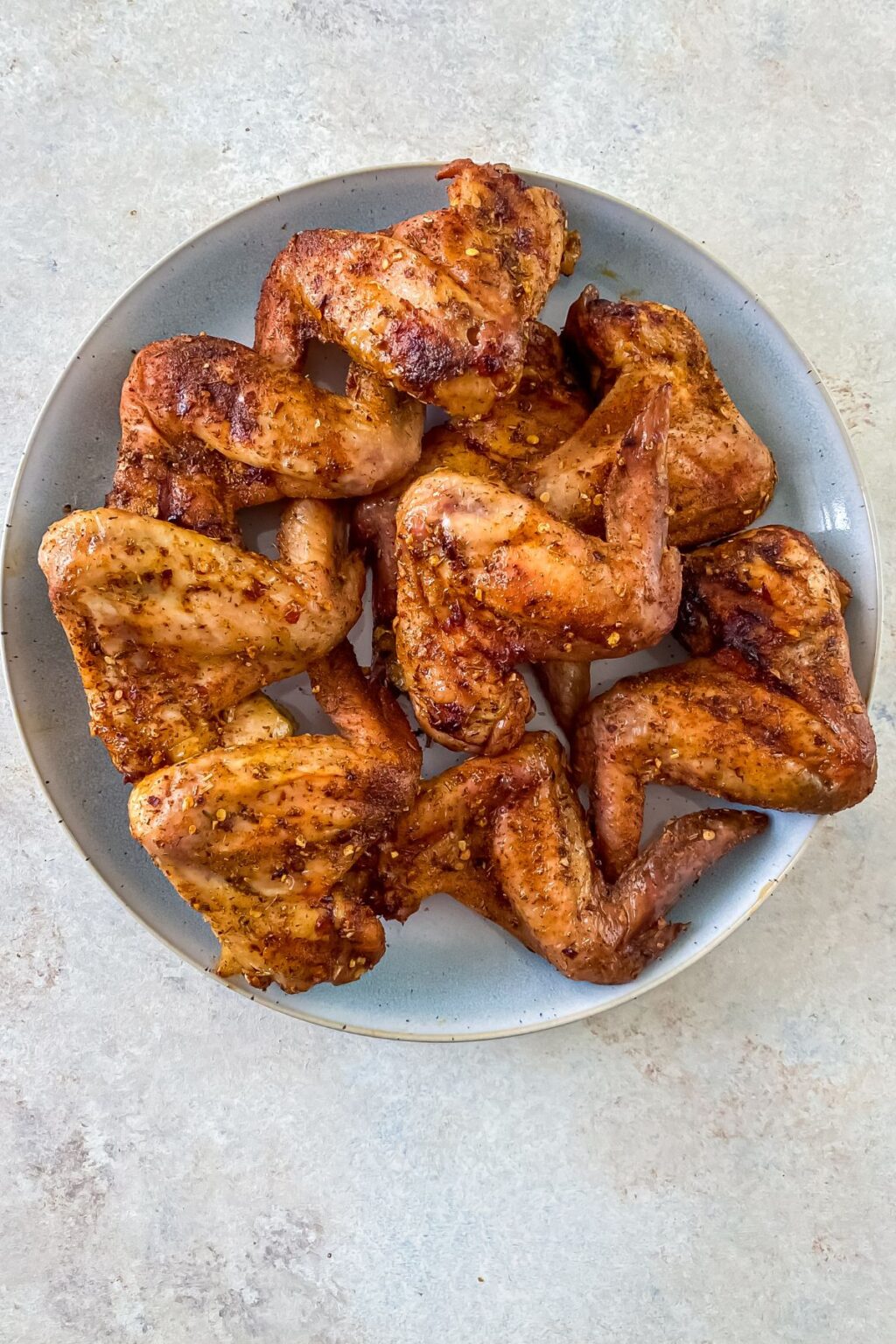 Smoked Chicken Wings on a light blue plate.