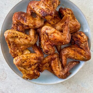 smoked chicken wings on a grey plate