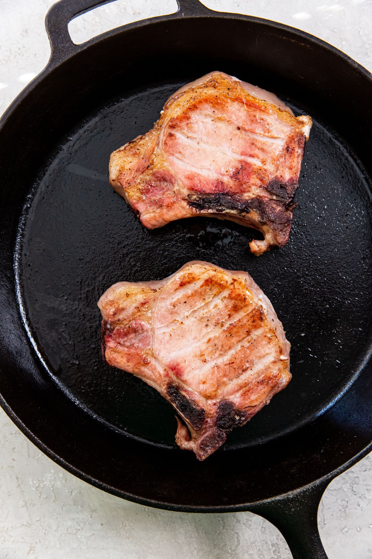 Traeger Smoked Pork Chops in a cast iron skillet