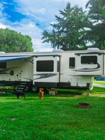 5th wheel camper set up at a grass campground in Kentucky.