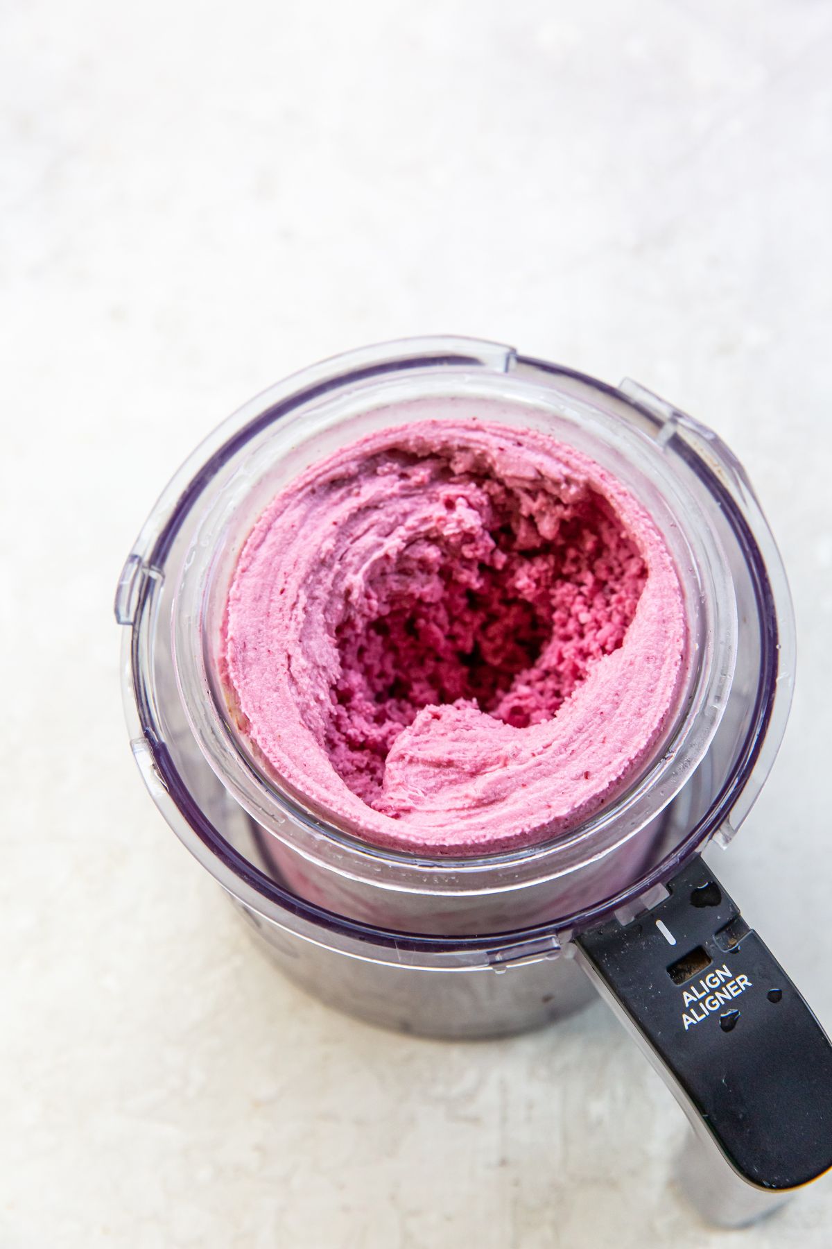 A blender filled with a pink mixture.