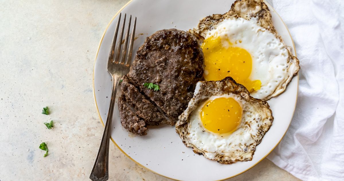 A plate with steak and eggs on it.