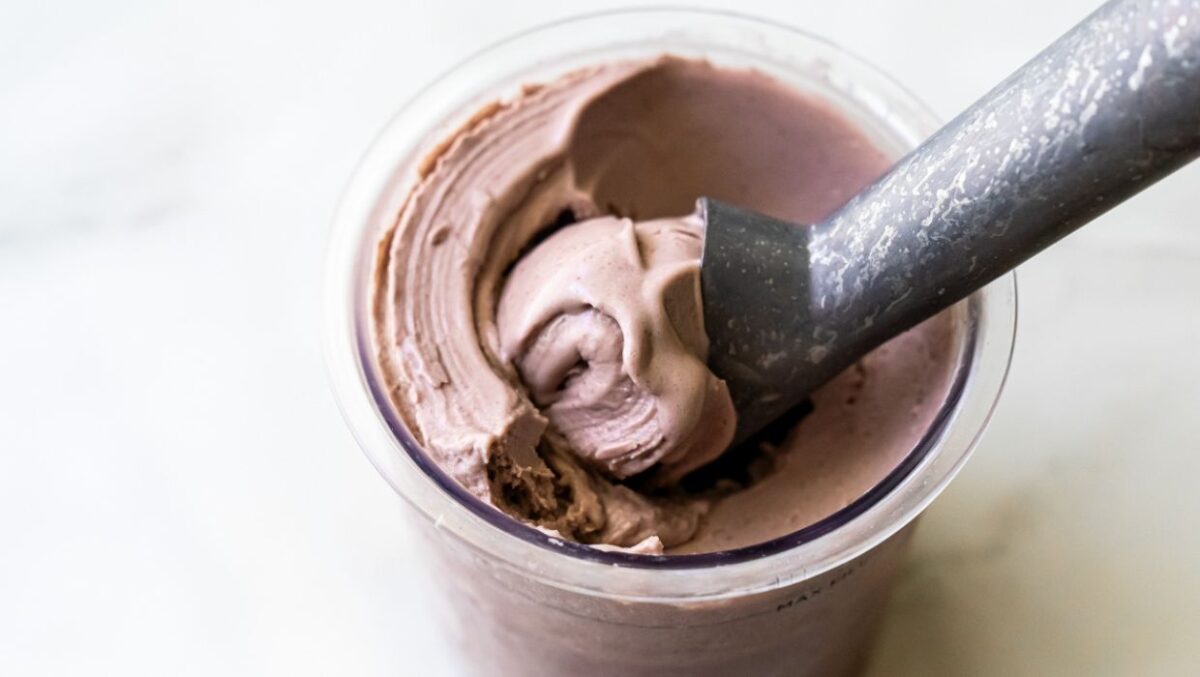 Ninja Creami acai ice cream with an ice cream scoop.