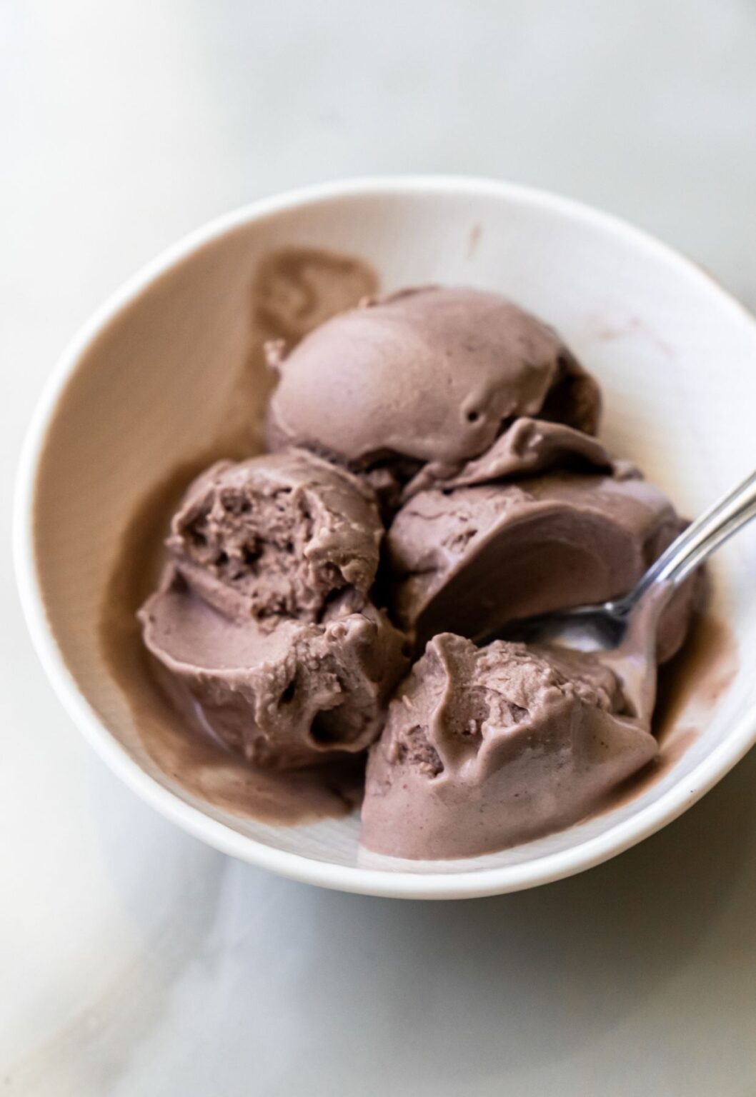 Ninja Creami acai ice cream with a spoon.