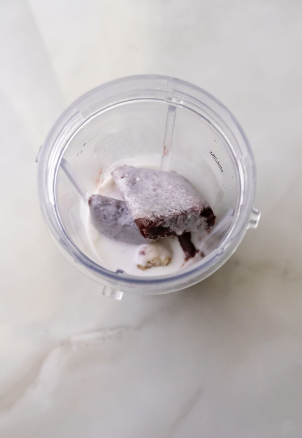 Acai ice cream in a clear cup.