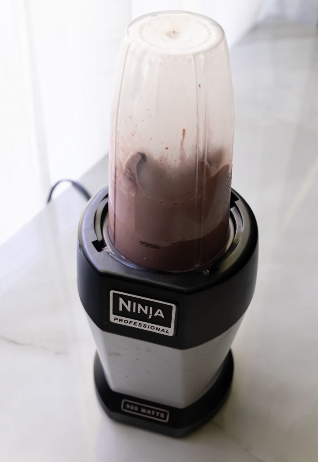 Acai ice cream base in a blender.