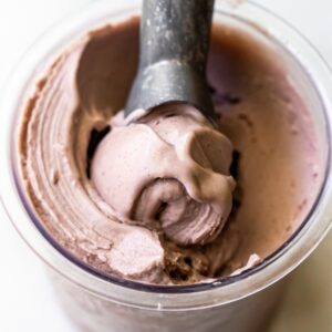 Ninja Creami acai ice cream with an ice cream scoop.