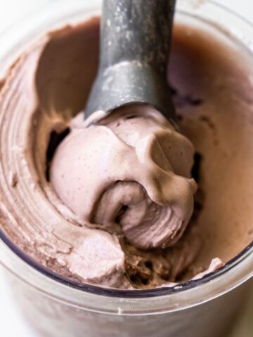 Ninja Creami acai ice cream with an ice cream scoop.
