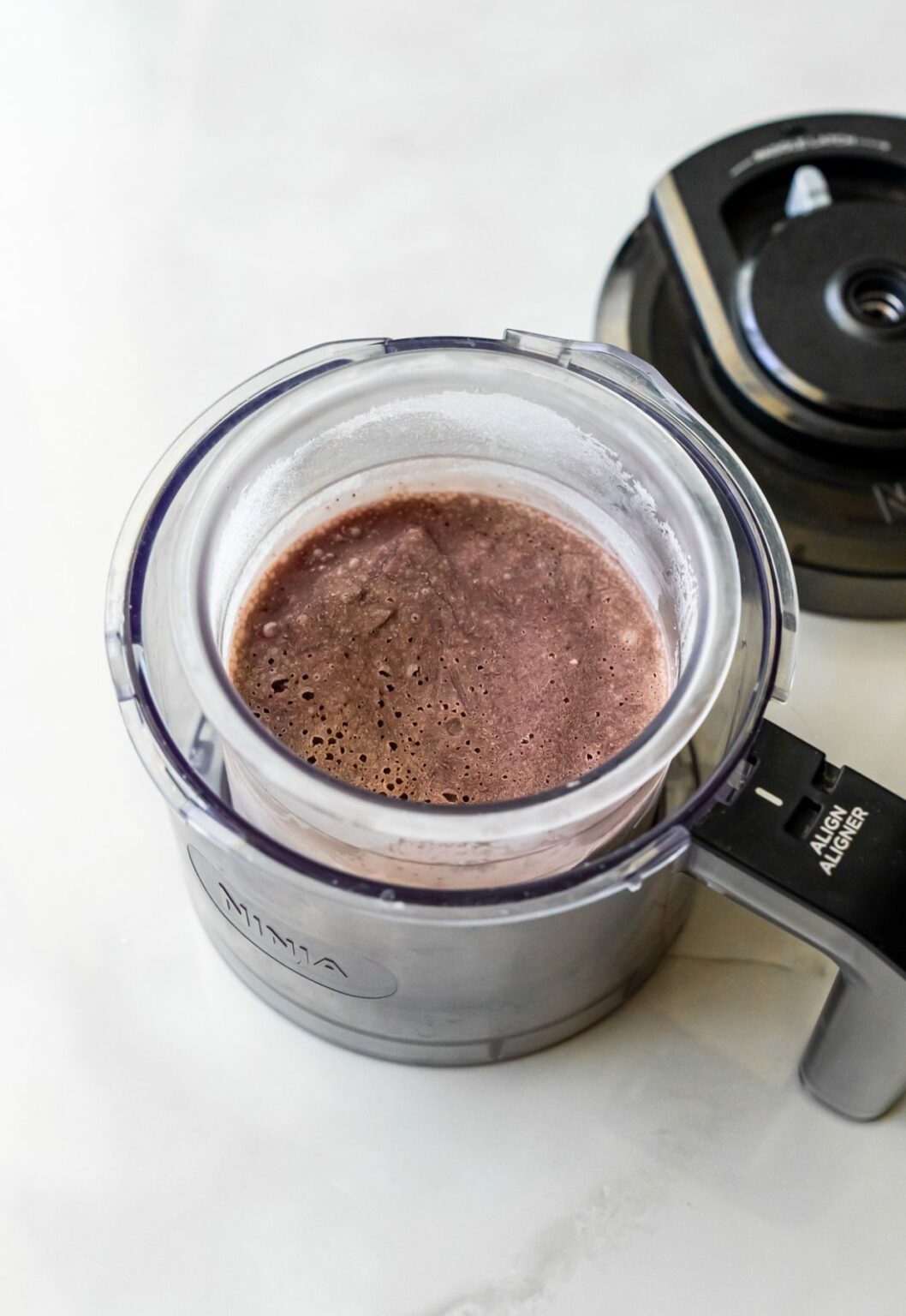 Acai ice cream in pint holder.