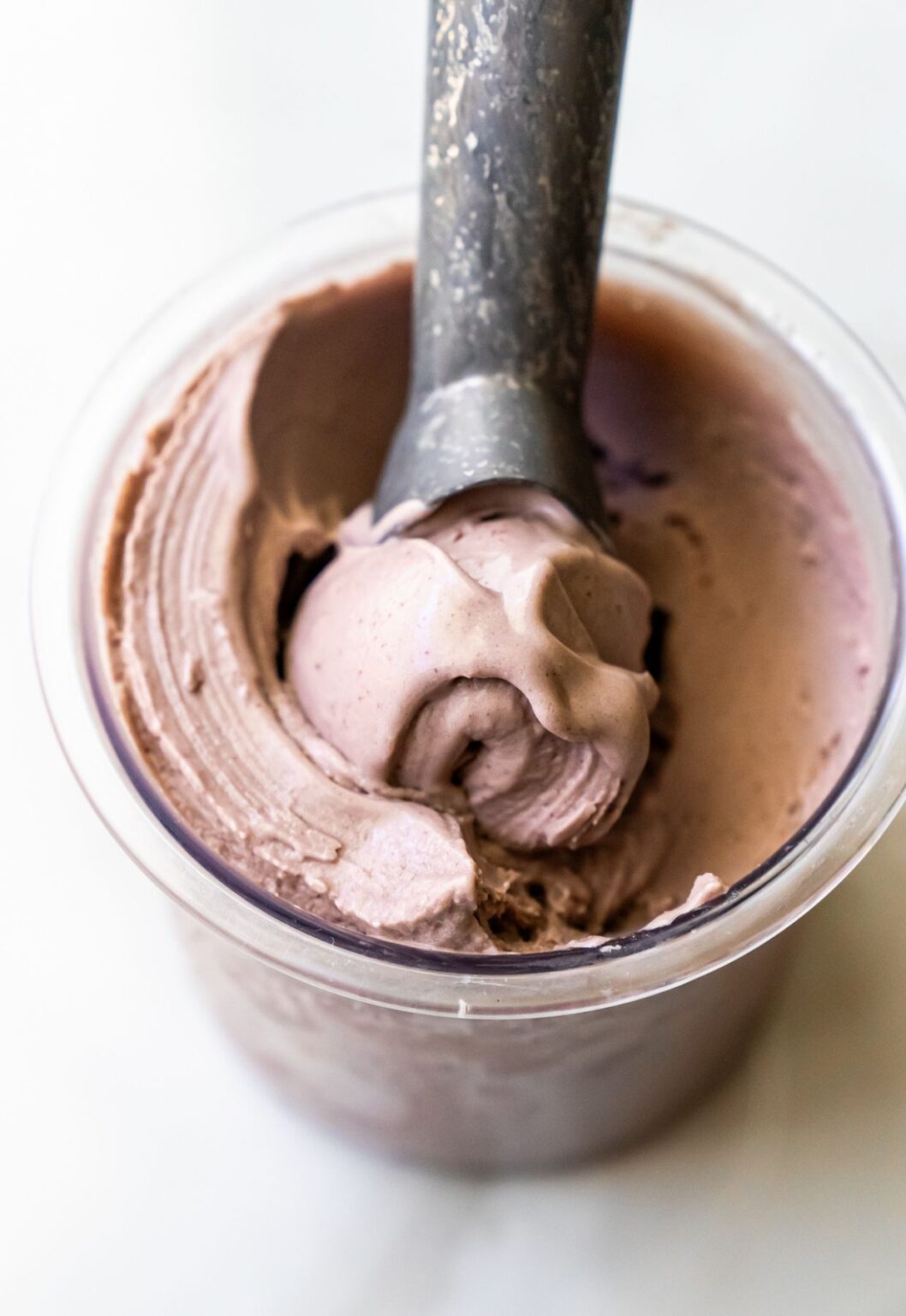 Ninja Creami acai ice cream with an ice cream scoop.