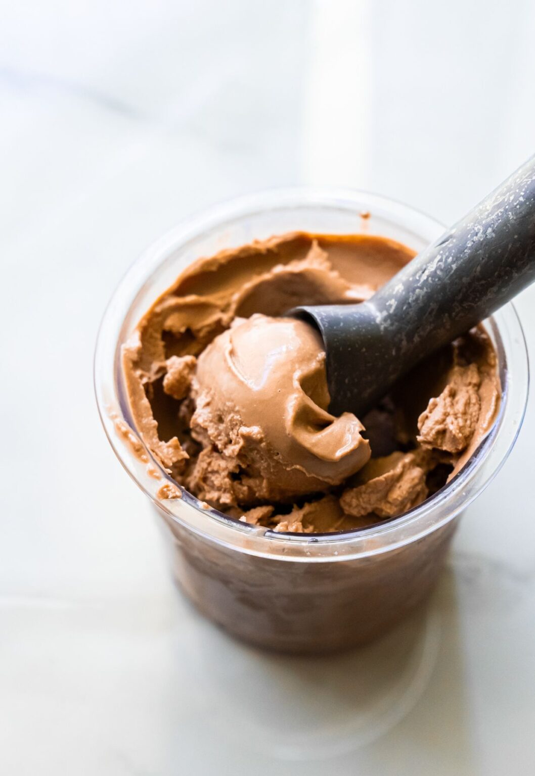 chocolate ice cream with an ice cream scoop.