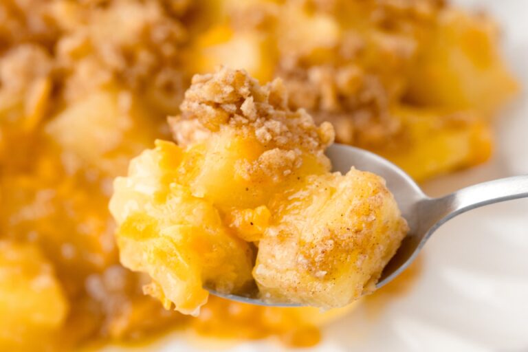 a photo of a spoonful of pineapple casserole
