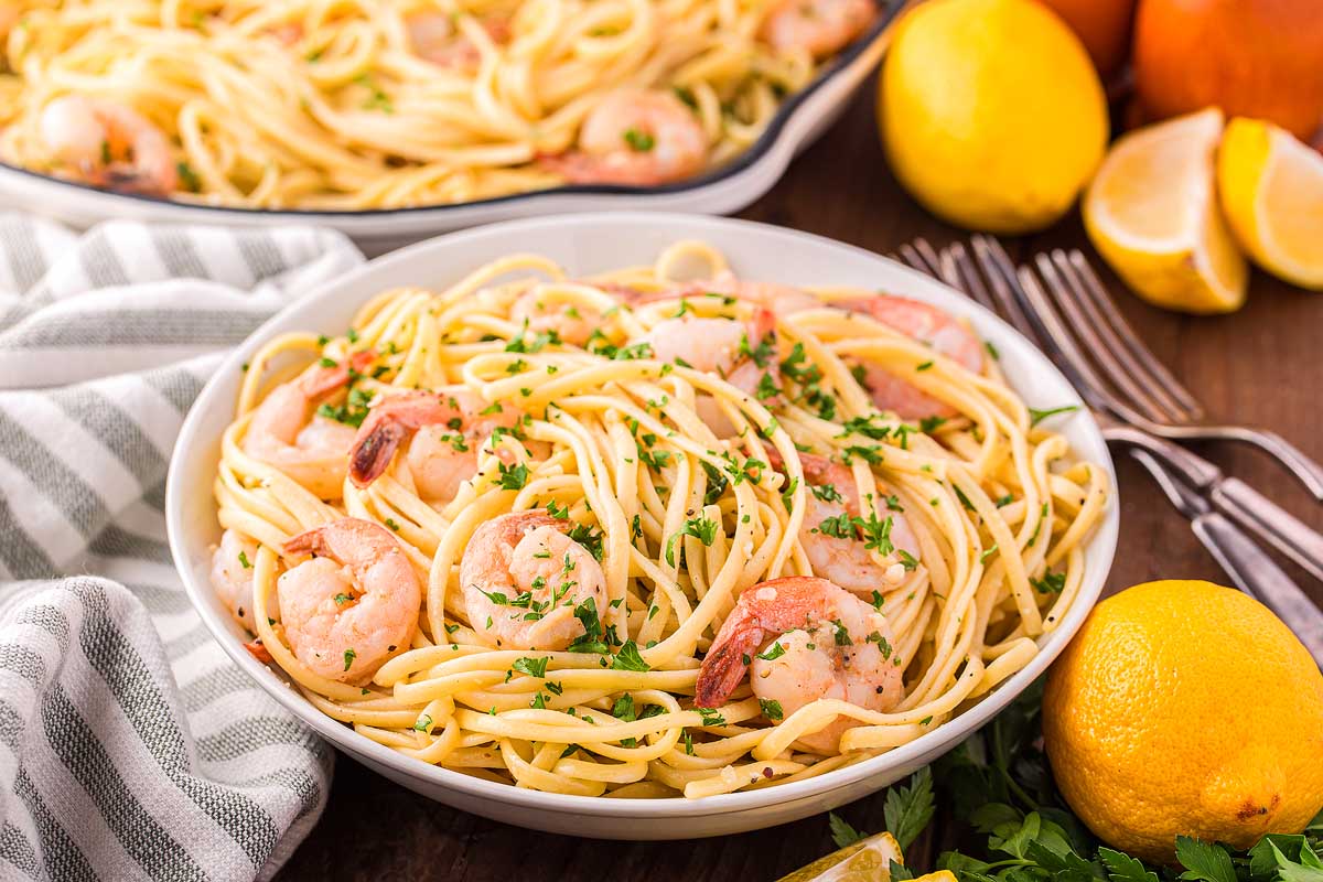 A bowl of liguine with shrimp.