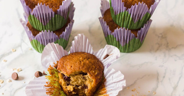 Chocolate Chip Oatmeal Muffins with one muffin opened in the front