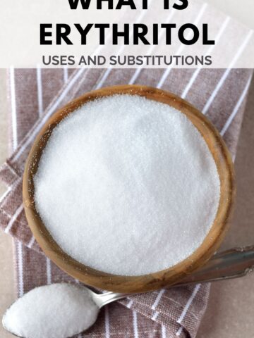 A bowl of erythritol on a striped cloth next to a spoonful of erythritol. The text above reads, "What is Erythritol: Uses and Substitutions." The bottom has the website name "laraclevenger.com".