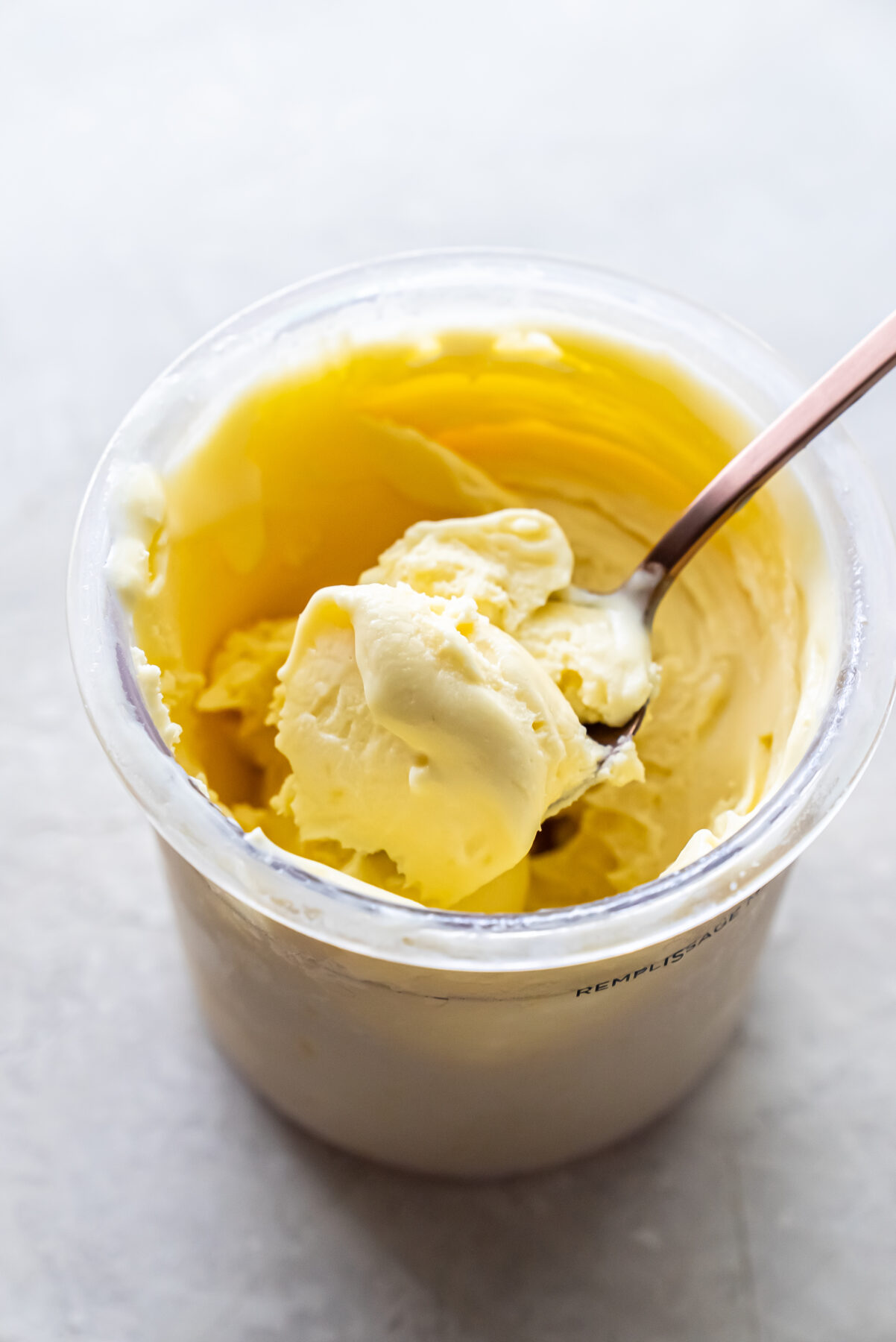mango ice cream with a spoon.