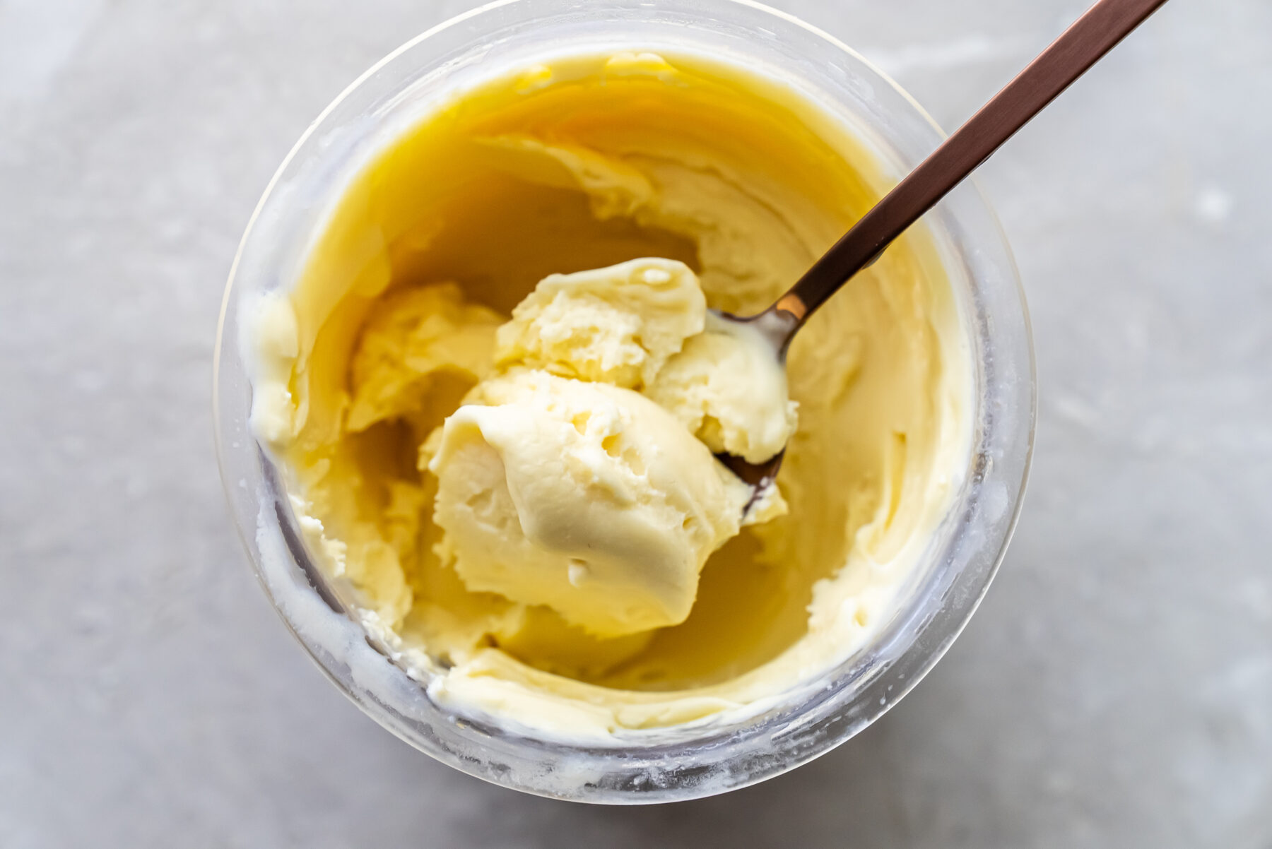 mango ice cream with a spoon.