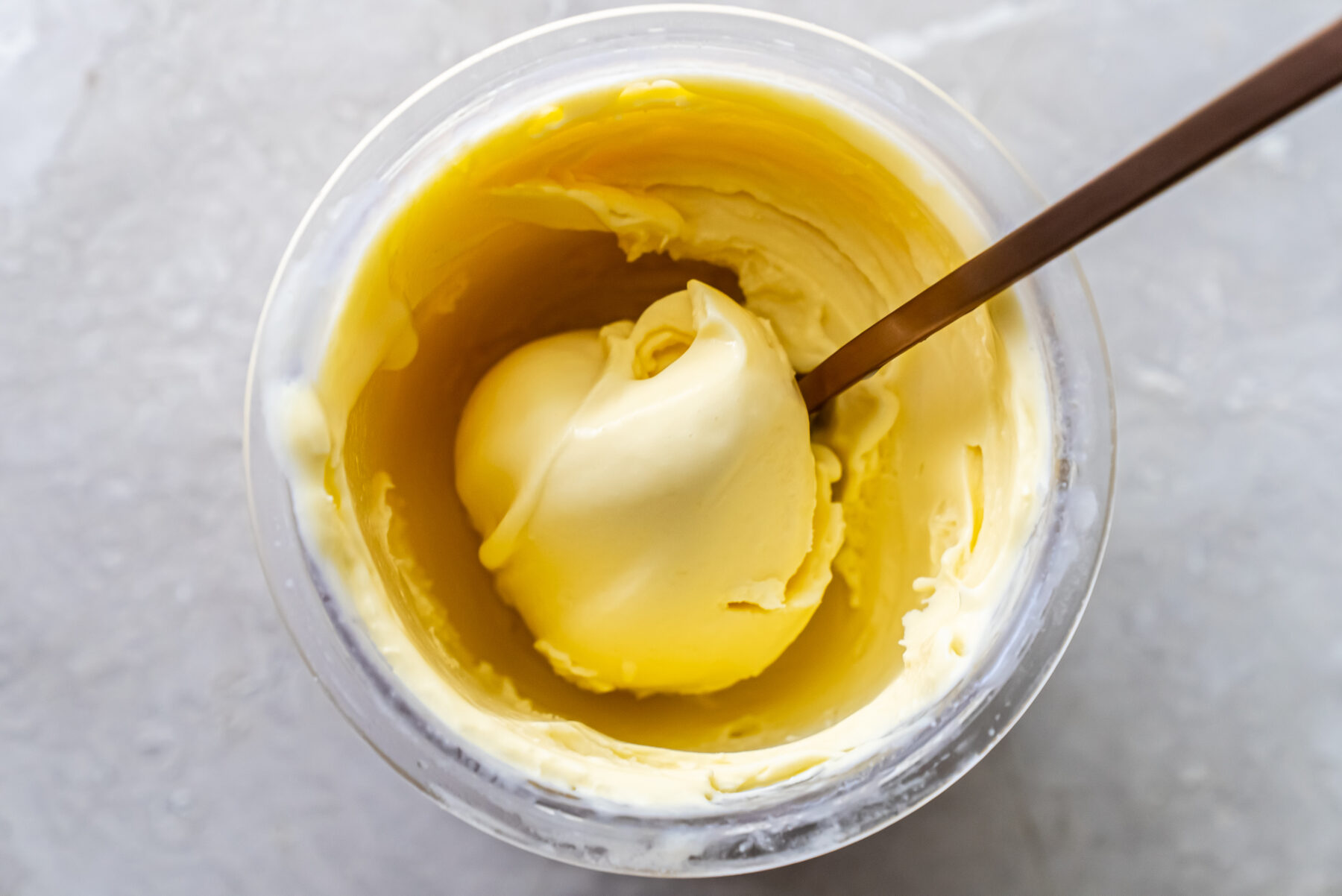 mango ice cream with a spoon.