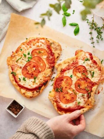2 pcs of Flatbread Pizza with red sauce dip on the side