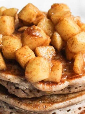 Apple Cinnamon Pancakes topped with chopped apples