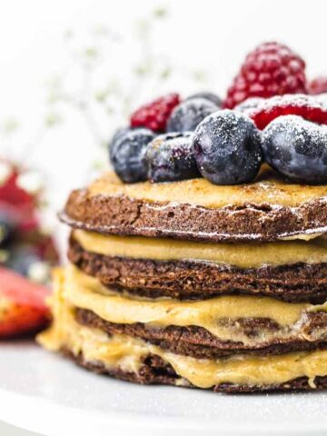 Chocolate Chaffle Cake layered and top with blueberry and raspberry