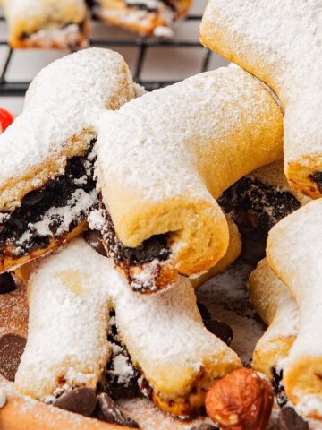 Italian Fig X Cookies in a plate with candy cane on the side