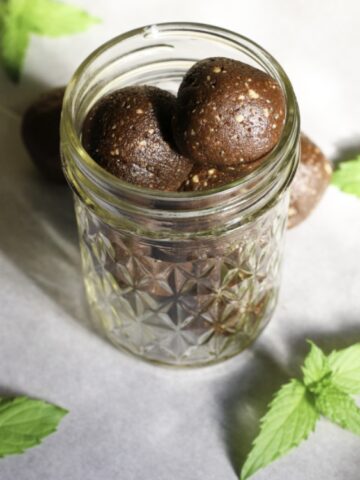 protein balls chocolate mint in a glass of jar.
