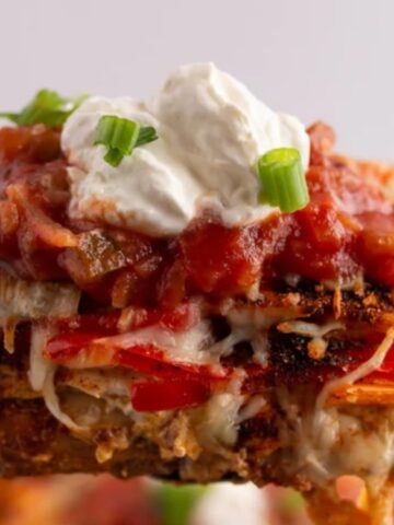 baked chicken breasts topped with a layer of cream cheese, mini sweet peppers, and shredded mozzarella cheese