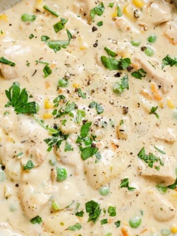 creamy chicken with mix veggies soup in a pot