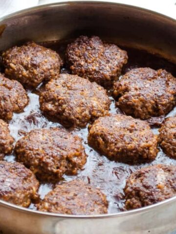 Salisbury steaks in a pan