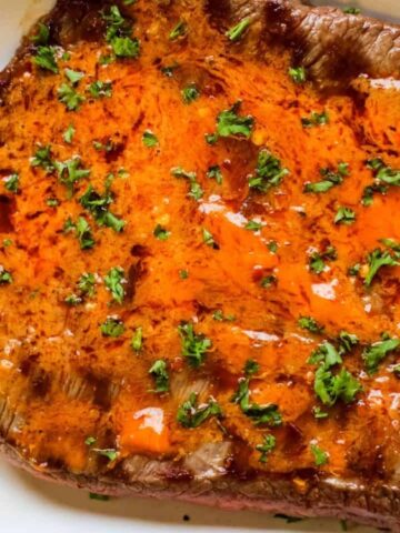 grilled steak with chicle paste on top.