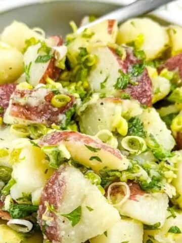 potato with green herbs of green garlic in a bowl