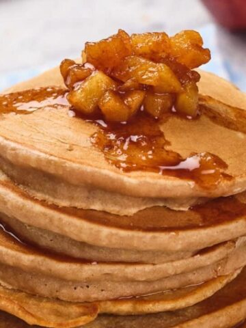 pile of pancakes with applesauce on top