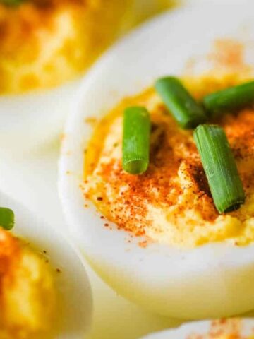 slice eggs seasoned with paprika and salt with onion leaks