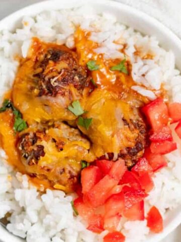 rice, meatballs and chopped tomato on the side