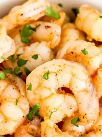shrimp garnish with chopped basil in a bowl