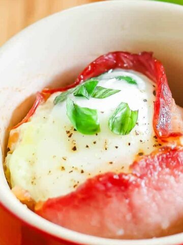 bacon wrapped in egg on a red cup