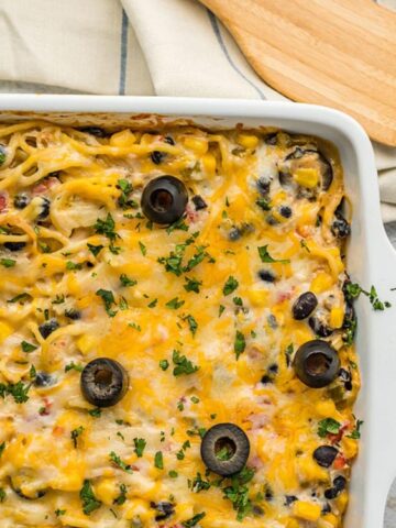 chicken, pasta, cheese, black beans, and corn baked on a casserole