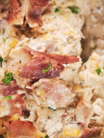 creamy cheese ranch chicken on a bowl with spoon