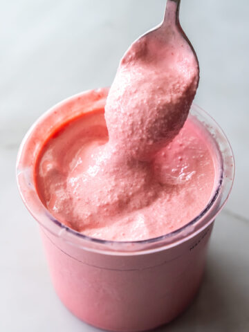 cherry protein ice cream with a spoon.