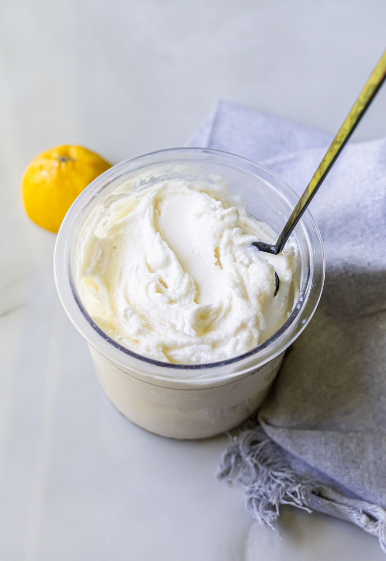lemon protein ice cream with a spoon.