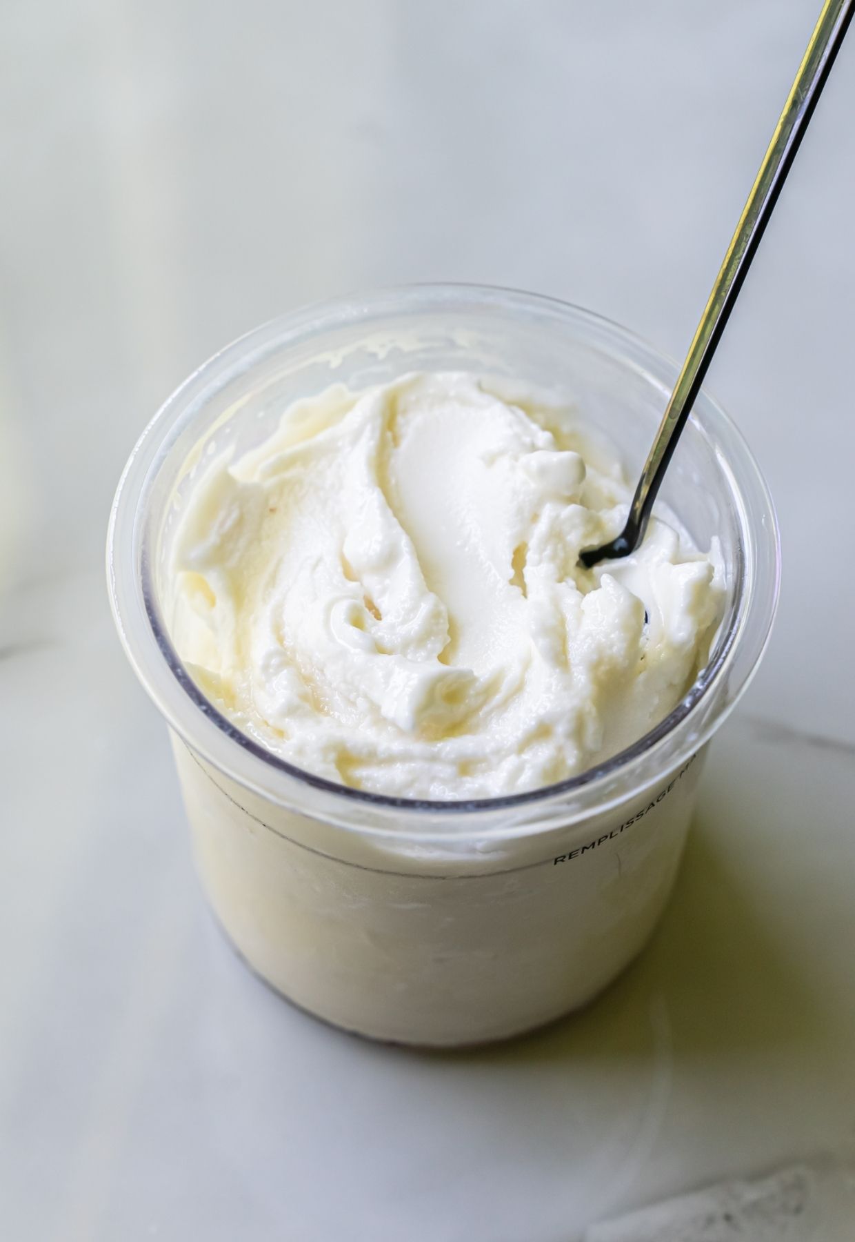 lemon protein ice cream with a spoon.