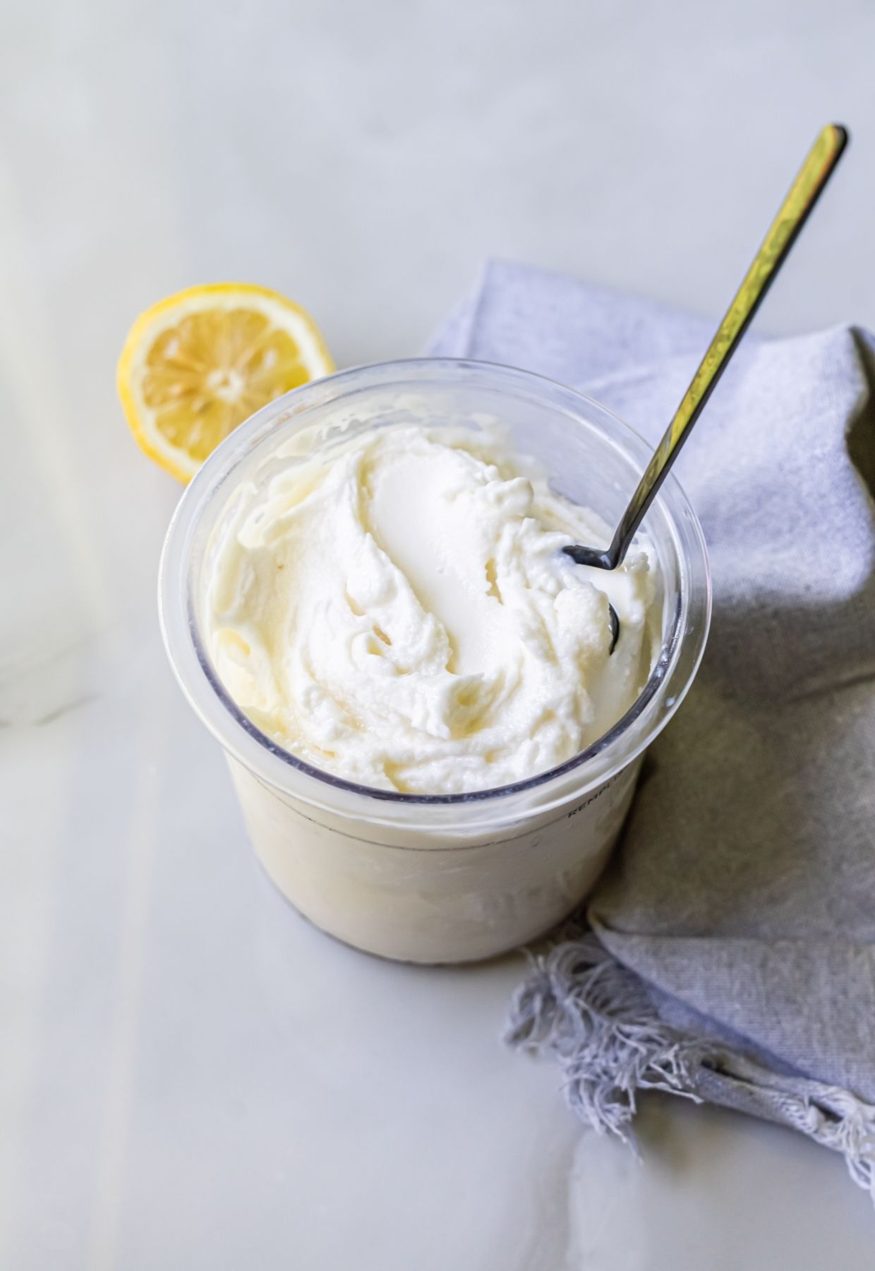 lemon protein ice cream with a spoon.