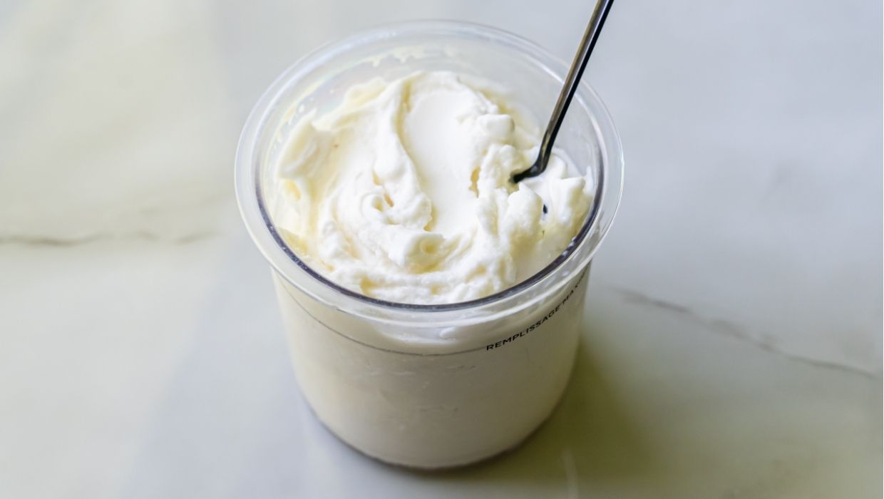 lemon protein ice cream with a spoon.