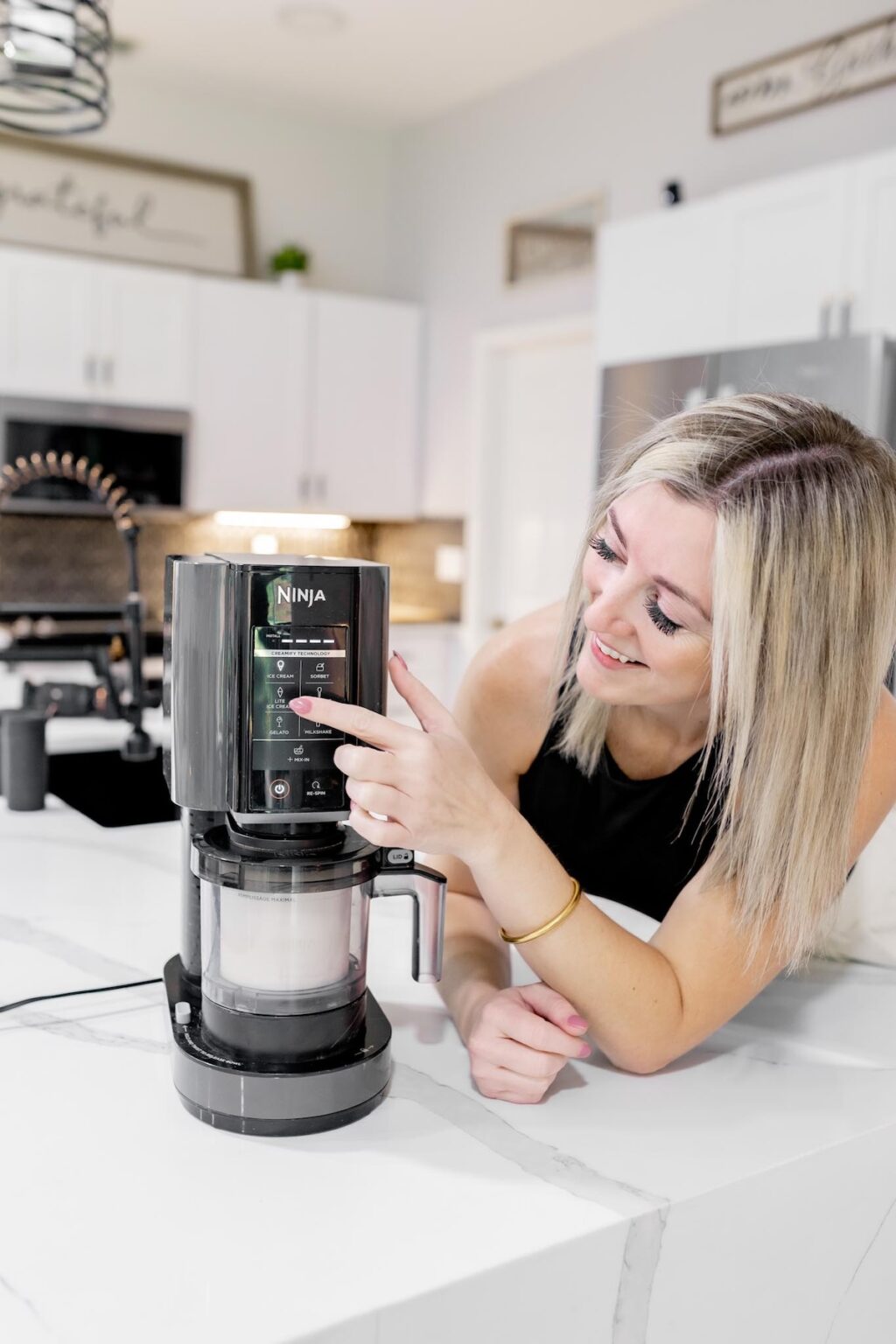 Girl with a Ninja Creami machine.