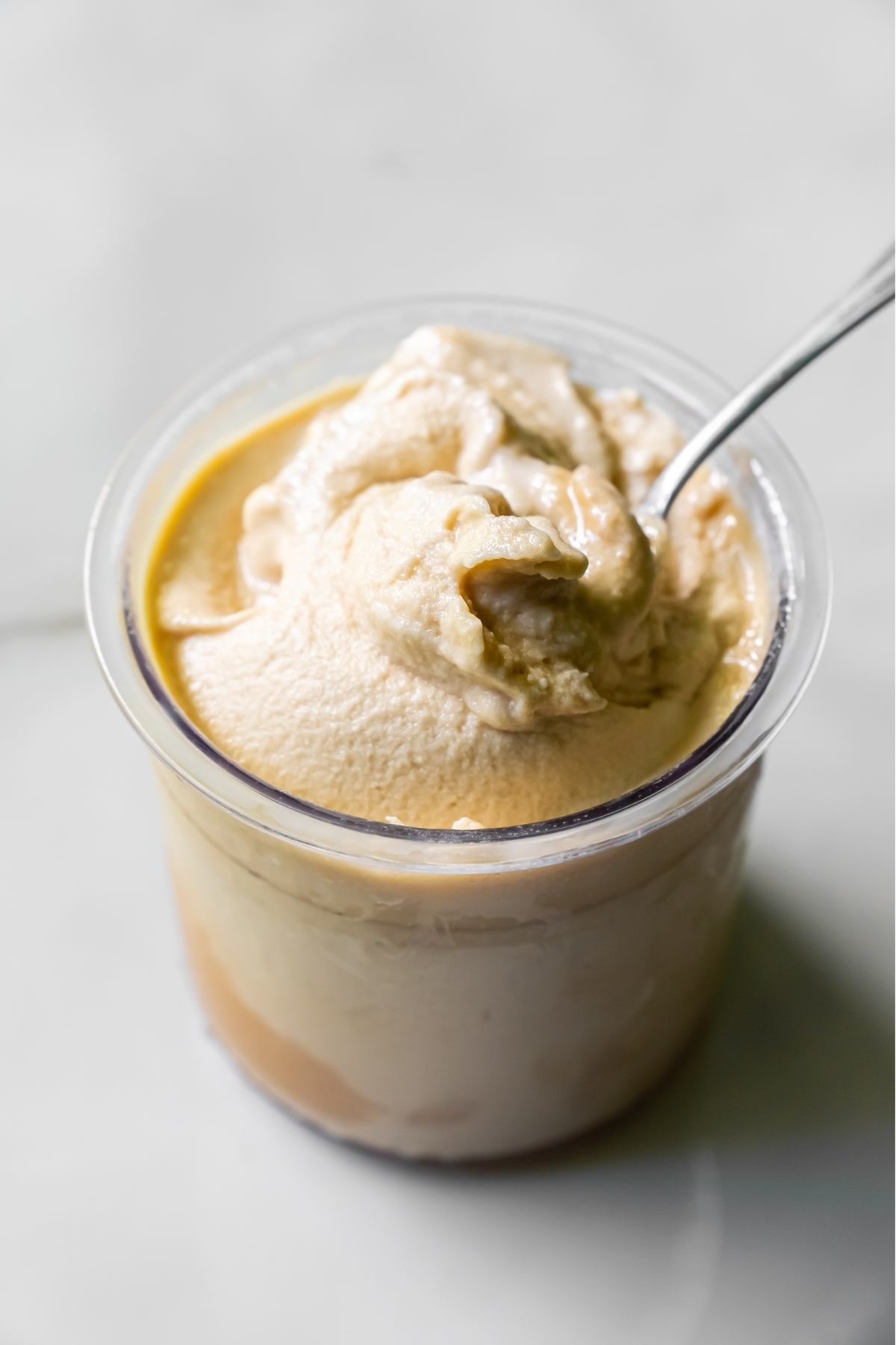 oat milk protein coffee ice cream with a spoon