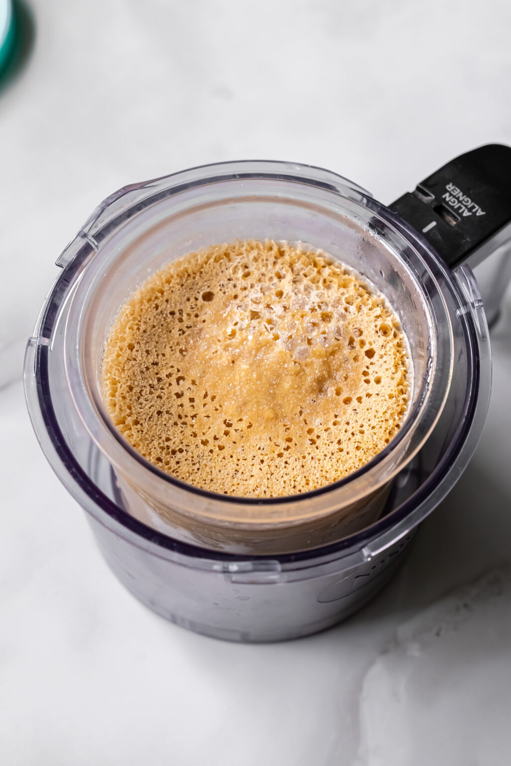 Frozen Oat Milk Protein Coffee mix in a pint placed in a pint holder